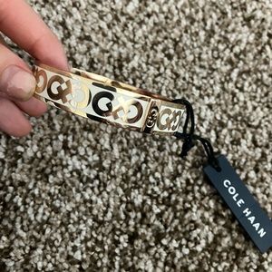 NWT Cole Haan SOLD OUT gold white enamel logo bracelet bangle new engraved
